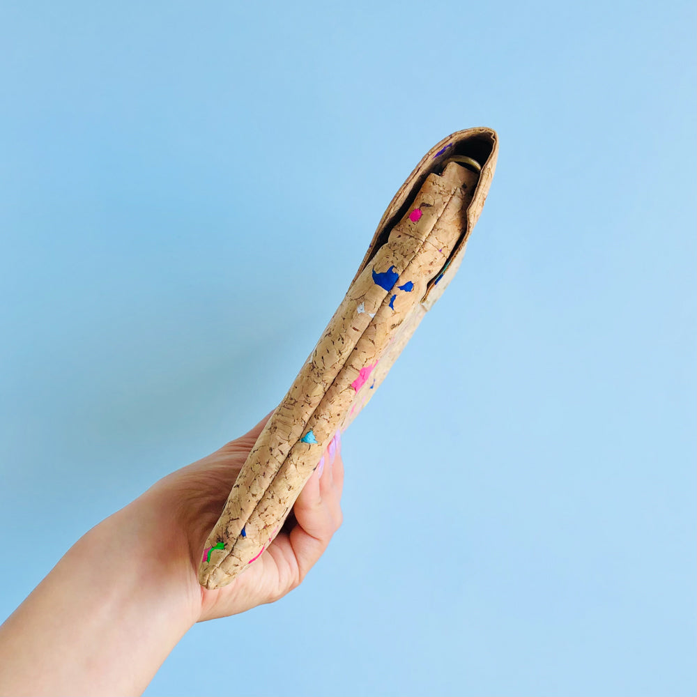 By The Sea Collection, model holding Aurora side way, colourful vegan cork leather shoulder bag, clutch bag