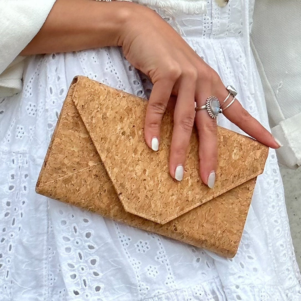 Model holding close up of By The Sea Collection, Flora, classic vegan cork leather shoulder bag