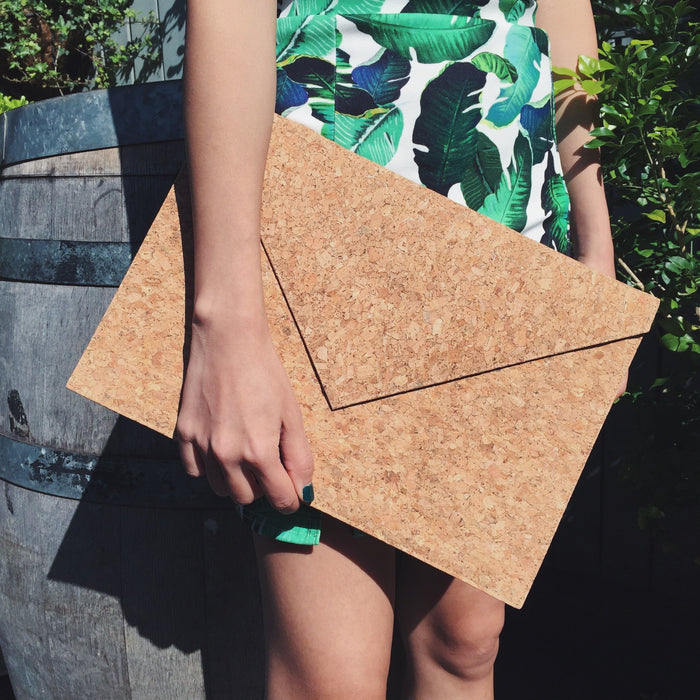 Model holding By The Sea Collection, Alice, classic vegan cork leather laptop document case