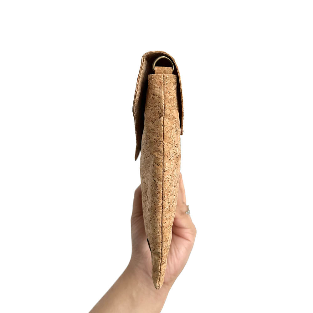 Model hand showing the sideway of By The Sea Collection, Aurora, classic vegan cork leather shoulder bag, clutch bag