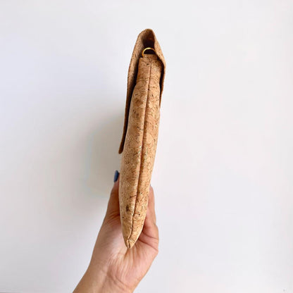 Model hand showing the sideway of By The Sea Collection, Aurora, gold vegan cork leather shoulder bag, clutch bag