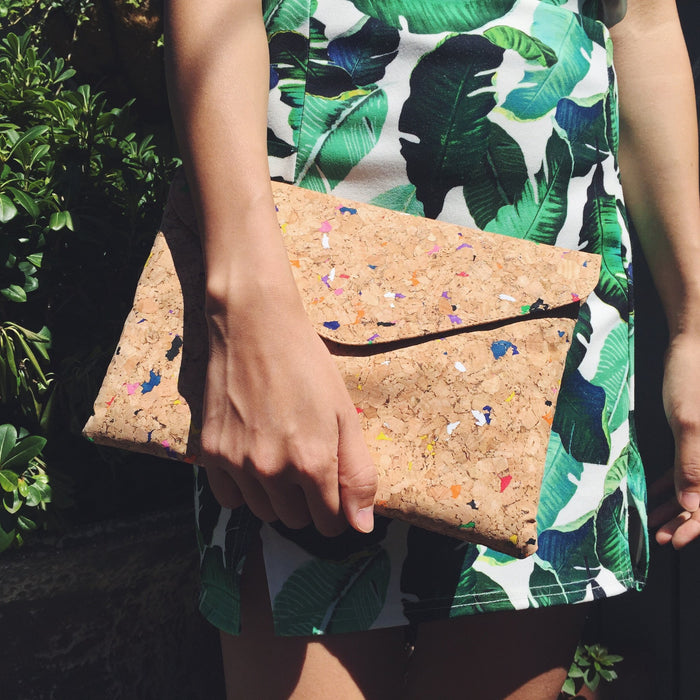 By The Sea Collection, model holding Aurora as a clutch, colourful vegan cork leather shoulder bag, clutch bag