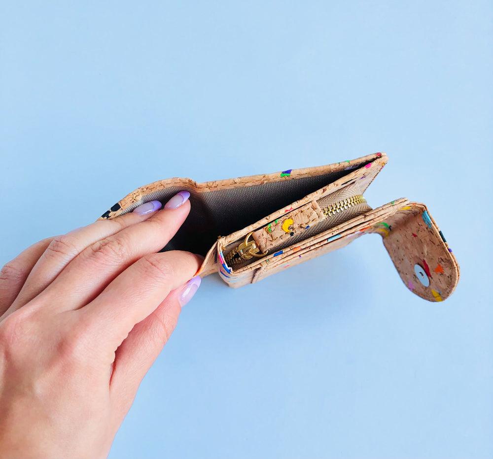 Model showing bill compartment top view of By The Sea Collection, Fiora, colourful vegan cork leather wallet