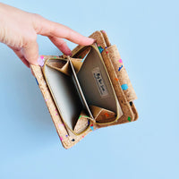 Model showing coin compartment top view of By The Sea Collection, Fiora, colourful vegan cork leather wallet