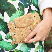 Model holding By The Sea Collection, Fiora, colourful vegan cork leather wallet