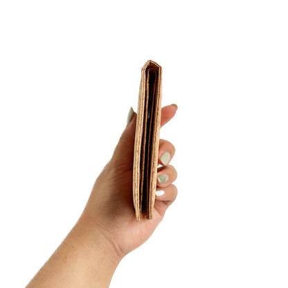 Model hand showing the side of By The Sea Collection, Henry, classic vegan cork leather compact wallet
