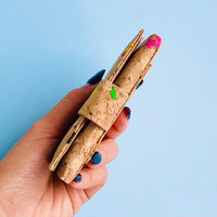 Model holding side, By The Sea Collection, Kate, colourful vegan cork leather compact wallets