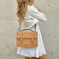 Model in white dress wearing on the shoulder By The Sea Collection, Keira, classic vegan cork leather handbag