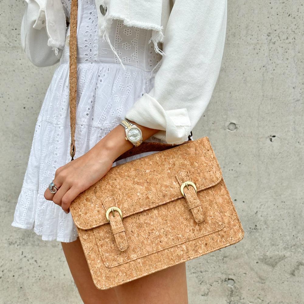 Model showing the crossbody style of By The Sea Collection, Keira, classic vegan cork leather handbag
