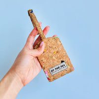 By The Sea Collection, model holding, Luke, colourful vegan cork leather luggage tag