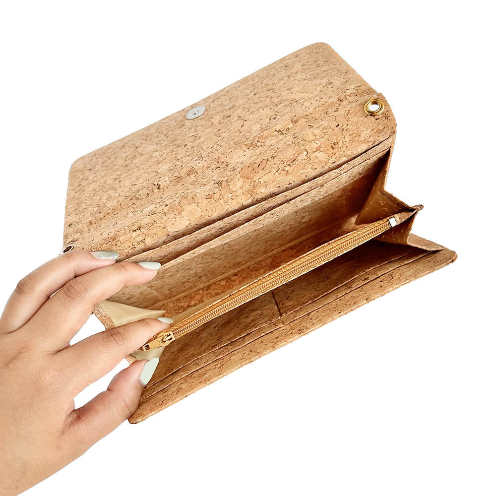 Model hand showing inside of By The Sea Collection, Lyla, classic vegan cork leather clutch