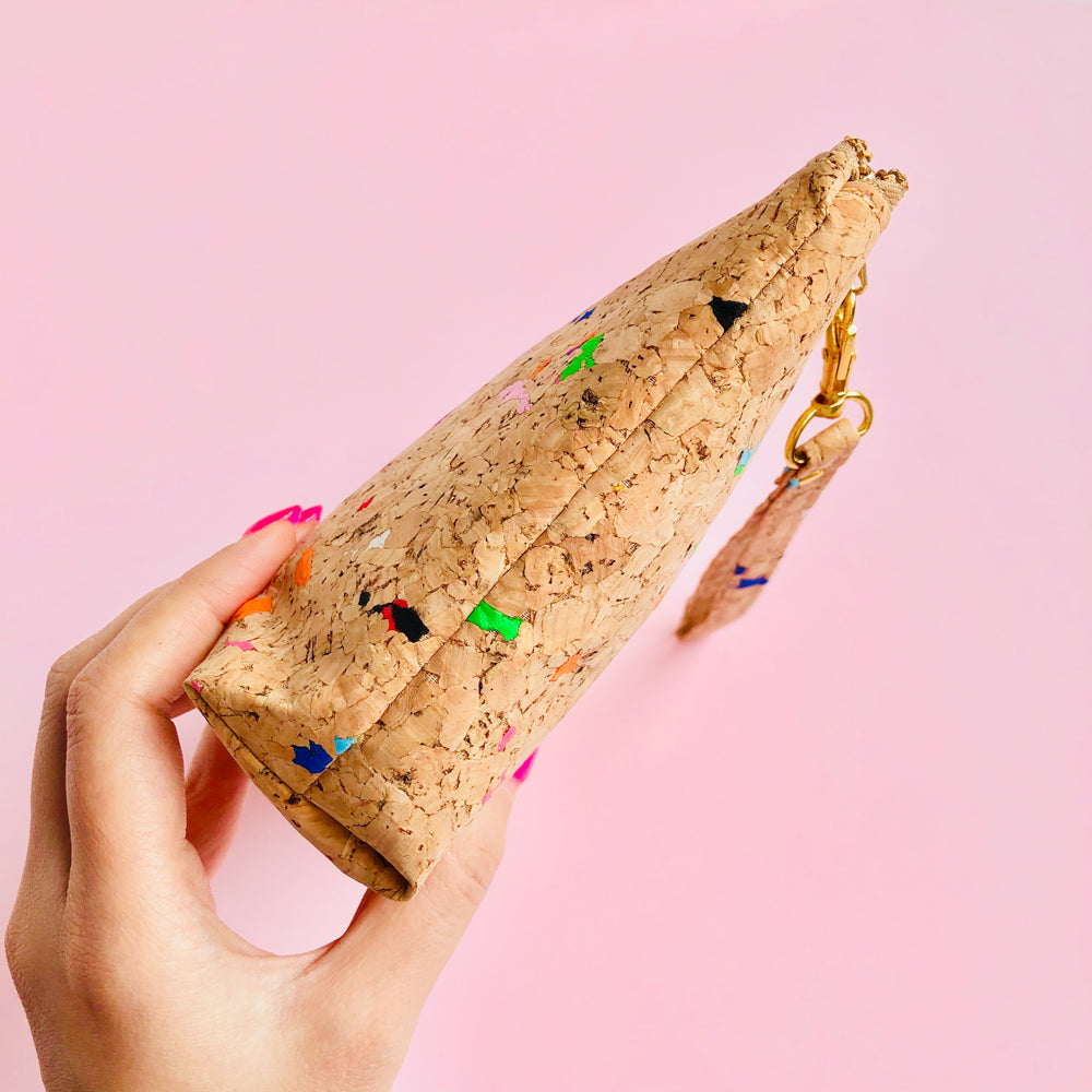 Woman holding By The Sea Collection, Miley, colourful vegan cork leather make up bag