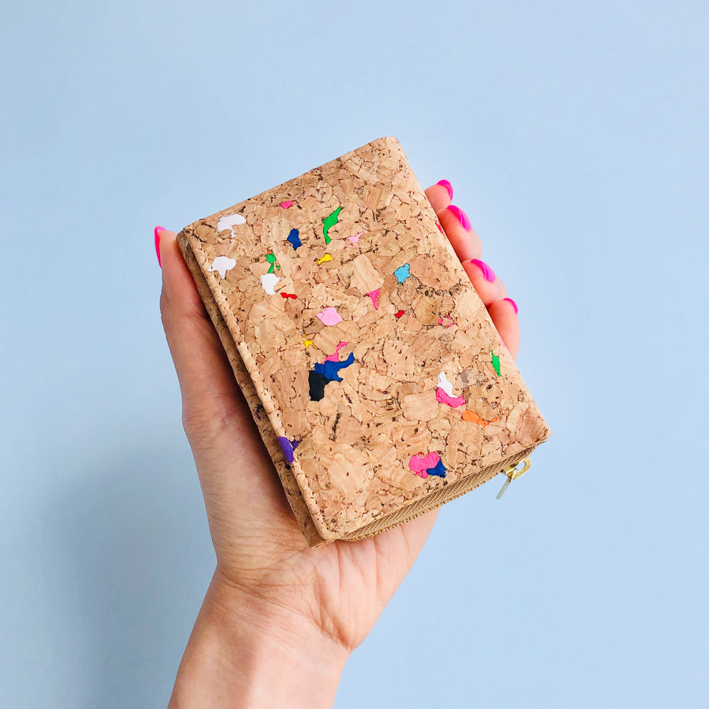 Woman holding By The Sea Collection, Nina, colourful vegan cork leather compact wallet