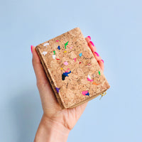 Woman holding By The Sea Collection, Nina, colourful vegan cork leather compact wallet